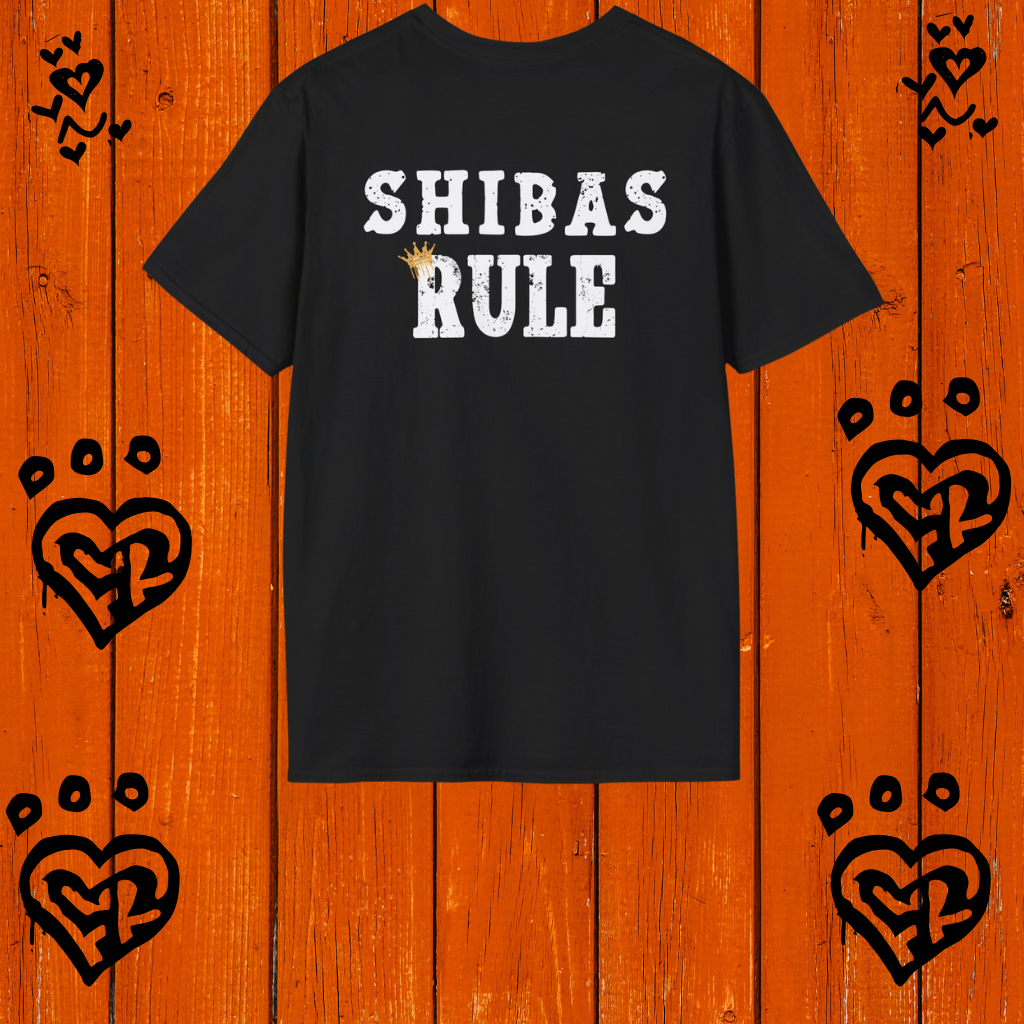 Black t-shirt with 'SHIBAS RULE' text on a wooden background with heart designs.
