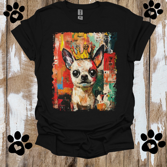 Black t-shirt with a colorful Chihuahua dog graphic on a wooden surface
