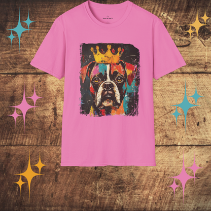 Pink t-shirt with a colorful  bOXER dog graphic and crown on a wooden surface with decorative stars.
