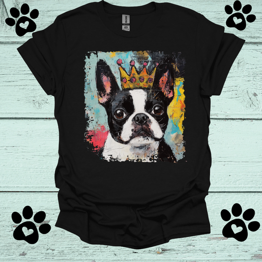 Black t-shirt with a Boston Terrier dog wearing a crown graphic on a light blue wooden background