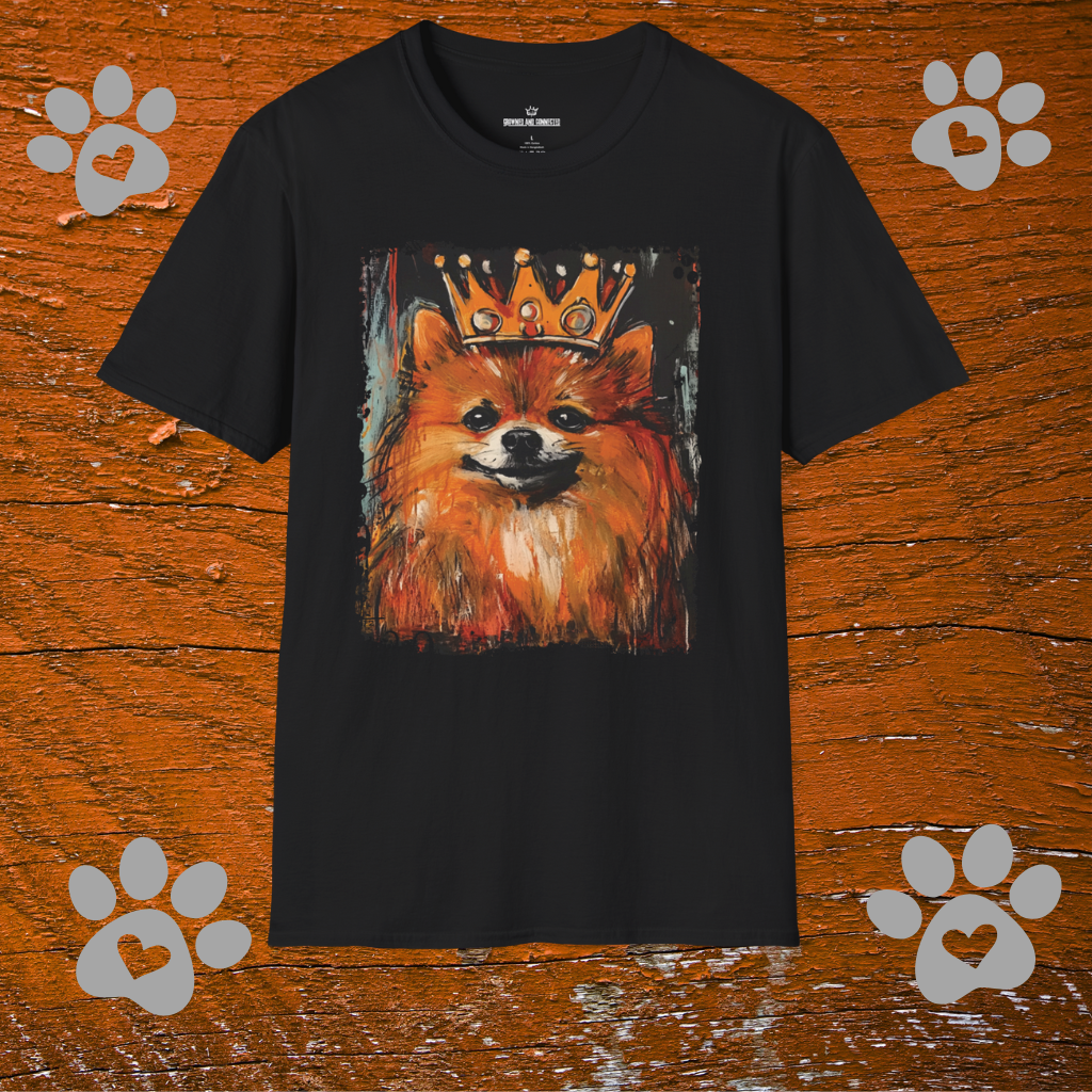 Black t-shirt with a Pomeranian dog wearing a crown graphic on a wooden background with paw prints.