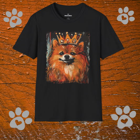 Black t-shirt with a Pomeranian dog wearing a crown graphic on a wooden background with paw prints.
