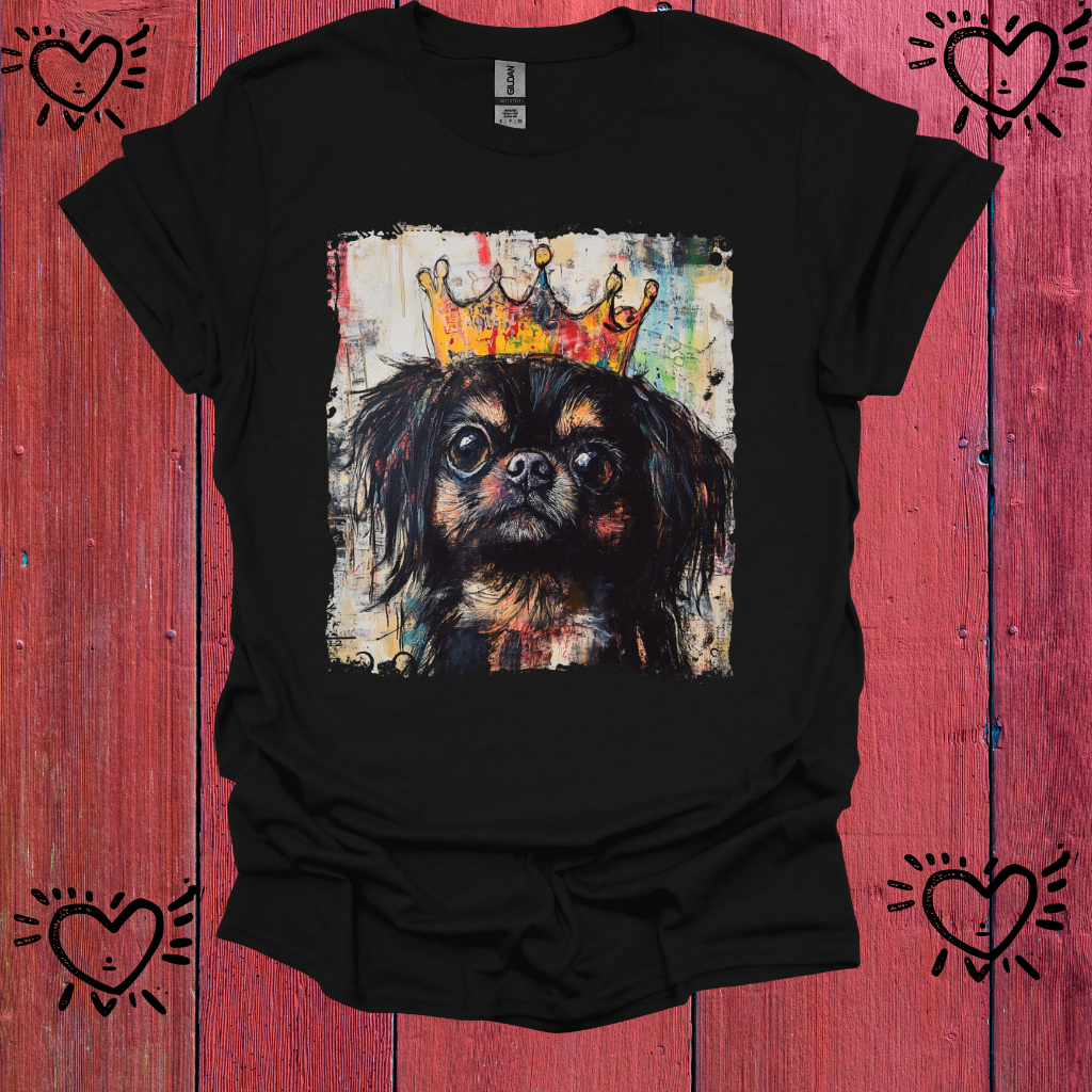 Black t-shirt with a dog wearing a crown graphic on a red wooden background