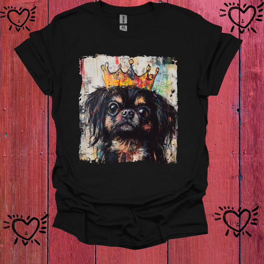 Black t-shirt with a dog wearing a crown graphic on a red wooden background